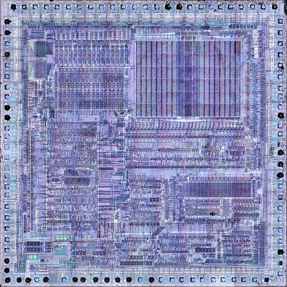 Fotografía del die de un microprocesador, usada como fondo del esquema de bloques